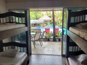 Postel nebo postele na pokoji v ubytování Hostal Hilltop Palomino