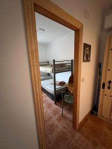 a mirror in a room with a bunk bed at Casa Darío in Ceuta