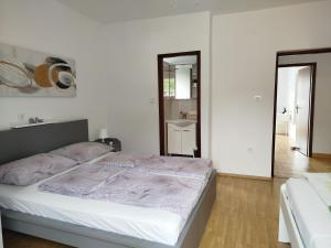 Ένα ή περισσότερα κρεβάτια σε δωμάτιο στο Apartman Ana