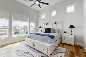 a bedroom with a bed and a ceiling fan at Blue Water Bluff in Kingsland +32 photos