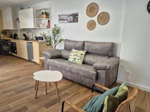 a living room with a couch and a table at Casa Boubous in Águilas