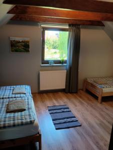 Posteľ alebo postele v izbe v ubytovaní Dom Mazurska Apartamenty