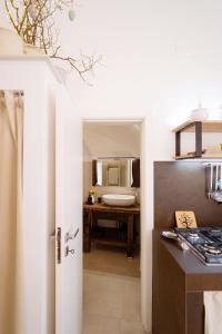 a kitchen with a sink and a counter top at Voltebianche in Martina Franca