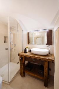 a bathroom with a sink and a shower at Voltebianche in Martina Franca +17 photos