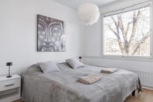 Ένα ή περισσότερα κρεβάτια σε δωμάτιο στο Marina Apartment in the Heart of Turku