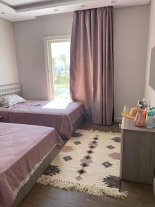 Ένα ή περισσότερα κρεβάτια σε δωμάτιο στο Sea view 5bedroom villa at mountain view north coast