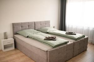 a bed with two towels on top of it at Ferienzimmer Albbruck in Albbruck