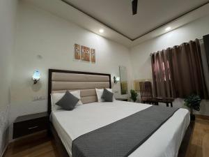 Postel nebo postele na pokoji v ubytování Hotel Sparkle Inn