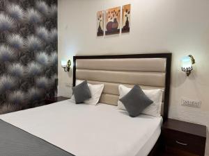 Postel nebo postele na pokoji v ubytování Hotel Sparkle Inn