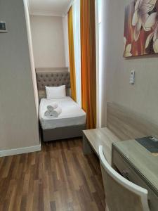 Postel nebo postele na pokoji v ubytování Hotel Empire Business Baku