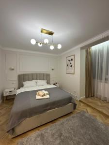 En eller flere senge i et værelse på Luxury Apartaments 0 Ultracentral Center