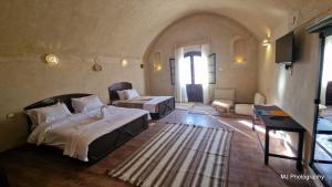 Postel nebo postele na pokoji v ubytování Hotel Talid