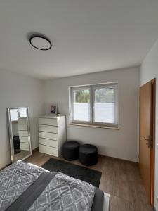 a bedroom with a bed and a mirror at Ferienwohnung Alte Brauerei in Leipzig