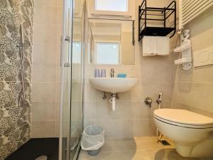 Koupelna v ubytování Hotel Iride Suite & Breakfast- ideale per famiglie e coppie + 83 fotografií