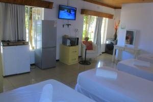 TV a/nebo společenská místnost v ubytování Creg Guest House Rustenburg
