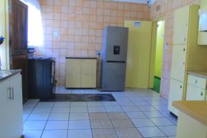 Kuchyň nebo kuchyňský kout v ubytování Creg Guest House Rustenburg