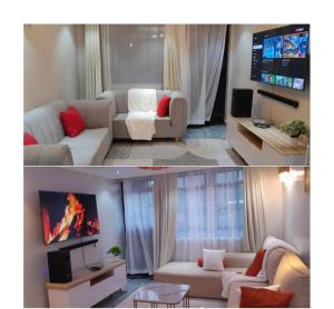 a living room with a white couch and a tv at Staycation by Winnie-Weber Generations -2 bedrooms in Nairobi