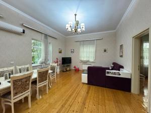 a living room with a couch and a table at Villa Botanica Lankaran in Lankaran