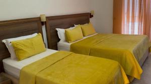 Postel nebo postele na pokoji v ubytování Grand Resort by Greccia Dhermi Prime