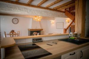 a kitchen with a sink and a counter top at Les gites Romeline in Montviron