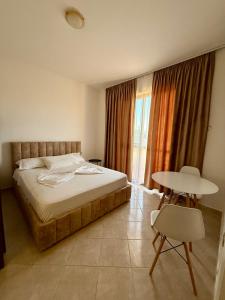 Postel nebo postele na pokoji v ubytování Hotel Ermi