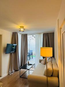 Televízia a/alebo spoločenská miestnosť v ubytovaní Apartment Stari Dvor