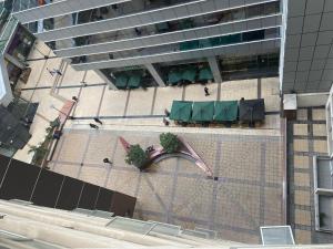 an overhead view of a building with tables and chairs at Comodo Depto Home Estudio IV in Santiago
