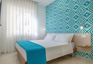 Postel nebo postele na pokoji v ubytování B&B Fiori D Arancio Sorrento