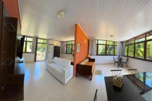 a living room with a couch and a table at Tapuio Park Hotel in Cavalcante