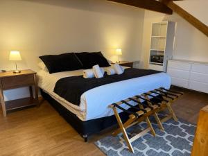 a bedroom with a large bed with two pillows at NB Mountain aparts El Chalten in El Chalten