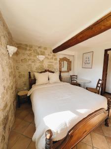 Postel nebo postele na pokoji v ubytování La Bastide des Pins