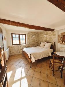 Postel nebo postele na pokoji v ubytování La Bastide des Pins