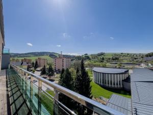 a view of a city from a balcony at Hotel Arman in Nižná