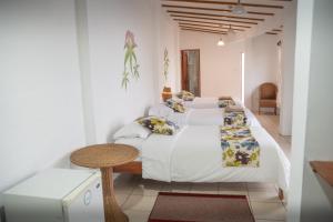Postel nebo postele na pokoji v ubytování Hotel Miconia + 37 fotografií