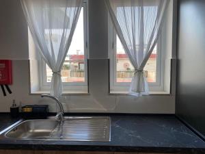 Η κουζίνα ή μικρή κουζίνα στο Modern Apartment in Qawra +21 φωτογραφίες