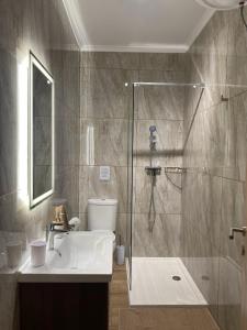 Ένα μπάνιο στο Modern Apartment in Qawra