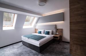Postel nebo postele na pokoji v ubytování Hotel Limanova