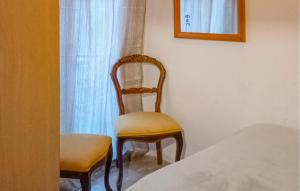 A bed or beds in a room at Cozy Apartment In Marina Di Santangelo