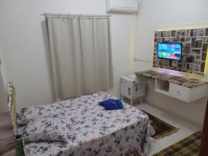 TV a/nebo společenská místnost v ubytování Hotel Pousada Girassol