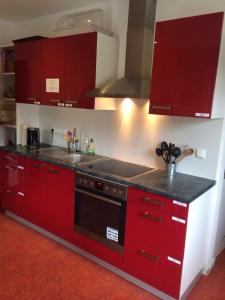
a kitchen with stainless steel appliances and a stove top oven at Hostel der Athleten in Garmisch-Partenkirchen
