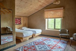 Postel nebo postele na pokoji v ubytování Pristine Hotel