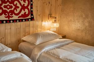 Postel nebo postele na pokoji v ubytování Pristine Hotel