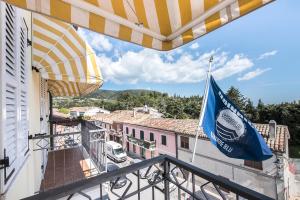 a view from a balcony with a flag at Stella Hotel in Sirolo