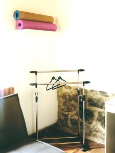 a glass table with two hangers on top of it at The Tree House in Cusco