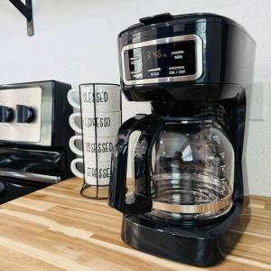 a black coffee maker sitting on top of a counter at Private, cozy, beach guest-suite C in Venice