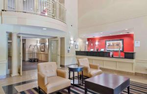 a lobby with a waiting area with chairs and a table at Extended Stay America - Atlanta - Marietta - Interstate N. Pkwy in Atlanta