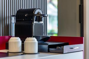 MH SUITES Plebiscito的咖啡和沏茶工具
