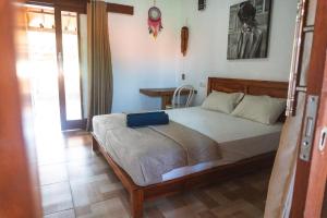 Postel nebo postele na pokoji v ubytování Naughty Nest Hostel Bali