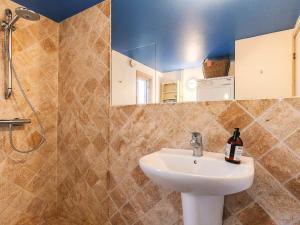 a bathroom with a sink and a mirror at 4 star holiday home in Liseleje in Liseleje +34 photos