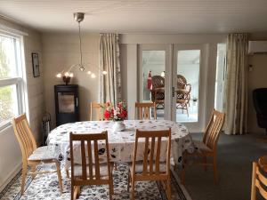 a dining room with a white table and chairs at 6 person holiday home in Ansager in Ansager